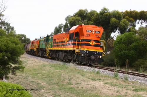 060110 2172
Cummins, empty grain train departing yard on the Penong mainline behind ARG 1200 class unit 1204, a Clyde Engineering EMD model G12C serial 65-428, originally built for the WAGR as the final unit of fourteen A class locomotives in 1965 and sent to the Eyre Peninsula in July 2004 and two 830 class AE Goodwin built ALCo model DL531 units 842 serial 84140 ex SAR broad gauge to Eyre Peninsula in October 1987, and 851 serial 84137 new to Eyre Peninsula in 1962. [url=https://goo.gl/maps/cL7ZN9y12t92]Approx. location of image[/url].
Keywords: 1200-class;1204;Clyde-Engineering-Granville-NSW;EMD;G12C;65-428;A-class;A1514;830-class;842;851;AE-Goodwin;ALCo;DL531;84137;84140;