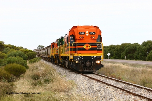 060110 2180
Near the 73 km and Cockaleechie Road grade crossing, empty grain train with ARG 1200 class unit 1204, a Clyde Engineering EMD model G12C serial 65-428, originally built for the WAGR as the final unit of fourteen A class locomotives in 1965 and sent to the Eyre Peninsula in July 2004 and two 830 class AE Goodwin built ALCo model DL531 units 842 serial 84140 ex SAR broad gauge to Eyre Peninsula in October 1987, and 851 serial 84137 new to Eyre Peninsula in 1962. [url=https://goo.gl/maps/LoznGHgHTUC2]Approx. location of image[/url].
Keywords: 1200-class;1204;Clyde-Engineering-Granville-NSW;EMD;G12C;65-428;A-class;A1514;830-class;842;851;AE-Goodwin;ALCo;DL531;84137;84140;