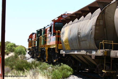 060111 2264
Tooligie, at the Tooligie Road grade crossing, the empty grain train continues north towards Murdinga. 11th January 2006.
