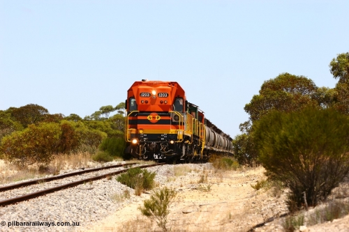 060111 2272
Peachna, Tooligie Hill Road grade crossing, empty grain train running north behind ARG 1200 class unit 1203, a Clyde Engineering EMD model G12C serial 65-427, one of fourteen originally built between 1960-65 for WAGR as their A class A 1513, fitted with dynamic brakes and financed by Western Mining Corporation, started working on the Eyre Peninsula in November 2004. 11th January 2006.
Keywords: 1200-class;1203;Clyde-Engineering-Granville-NSW;EMD;G12C;65-427;A-class;A1513;