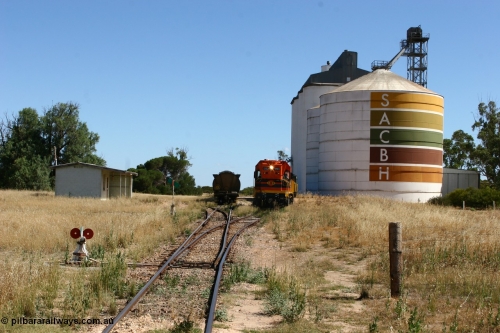 060111 2322
Warramboo, located at the 190.2 km with now disused station building on the left, Clyde Engineering built EMD G12C model loco 1203 serial 65-427 shunts empty grain waggons into the grain loop for loading. 11th January 2006.
Keywords: 1200-class;1203;Clyde-Engineering-Granville-NSW;EMD;G12C;65-427;A-class;A1513;