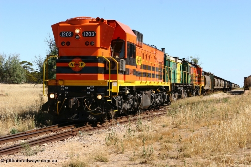 060111 2332
Warramboo, located at the 190.2 km and opened with the line in May 1913, with now disused station building on the left, Clyde Engineering built EMD G12C model loco 1203 serial 65-427 stands on the mainline as loading on the grain siding has started. 11th January 2006.
Keywords: 1200-class;1203;Clyde-Engineering-Granville-NSW;EMD;G12C;65-427;A-class;A1513;