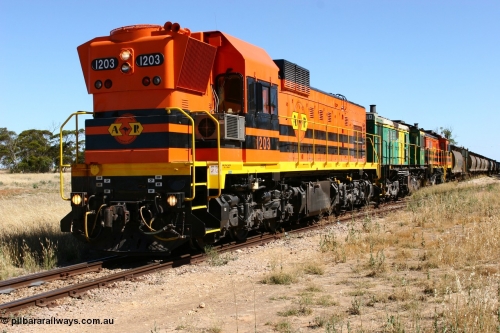060111 2334
Warramboo, located at the 190.2 km and opened with the line in May 1913, with now disused station building on the left, Clyde Engineering built EMD G12C model loco 1203 serial 65-427 stands on the mainline as loading on the grain siding has started. 11th January 2006.
Keywords: 1200-class;1203;Clyde-Engineering-Granville-NSW;EMD;G12C;65-427;A-class;A1513;