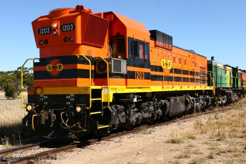 060111 2335
Warramboo, located at the 190.2 km and opened with the line in May 1913, with now disused station building on the left, Clyde Engineering built EMD G12C model loco 1203 serial 65-427 stands on the mainline as loading on the grain siding has started. 11th January 2006.
Keywords: 1200-class;1203;Clyde-Engineering-Granville-NSW;EMD;G12C;65-427;A-class;A1513;