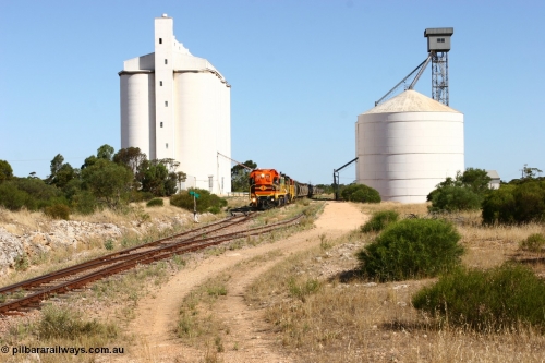 060111 2341
Kyancutta, the concrete and steel silo complexes frame ARG 1200 class unit 1203, a Clyde Engineering EMD model G12C serial 65-427, one of fourteen originally built between 1960-65 for WAGR as their A class A 1513, fitted with dynamic brakes and financed by Western Mining Corporation, started working on the Eyre Peninsula in November 2004 as it leads a north bound empty grain train. 11th January 2006.
Keywords: 1200-class;1203;Clyde-Engineering-Granville-NSW;EMD;G12C;65-427;A-class;A1513;