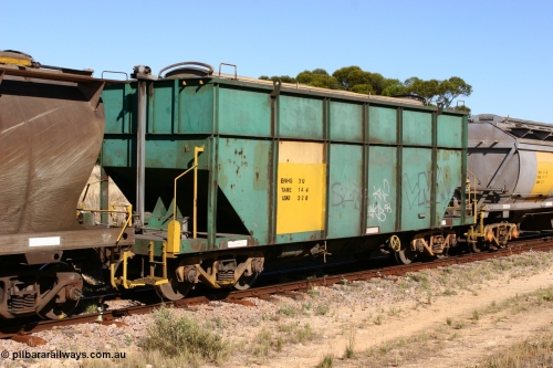 060111 2352
Kyancutta, former Australian National narrow gauge ENHG type bogie grain waggon ENHG 3, originally built by Moore Road Ind, Victoria as NB type NB 1398 ballast hopper for the NAR, then to standard gauge in 1975 as BA type BA 1540, recoded to AHTY in 1980, to EP April 1984, recoded to NHG type NHG 6 in May 1984, then again to ENHT type ENHT 6 in March 1985 and further rebuilt forming one half of ENHG type grain waggon in August 1986. The conversion involved splicing two AHTY-ENHT type waggons together at Port Lincoln workshops, roll top cover visible, part of an empty train. 11th January 2006.
Keywords: ENHG-type;ENHG3;Moore-Road-Ind-Victoria;NB-type;NB1398;BA-type;BA1540;AHTY-type;NHG-type;NHG6;ENHT-type;