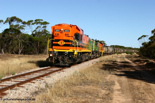 060111 2393
Wannamana, ARG 1200 class unit 1203, a Clyde Engineering EMD model G12C serial 65-427, one of fourteen originally built between 1960-65 for WAGR as their A class A 1513, fitted with dynamic brakes and financed by Western Mining Corporation, started working on the Eyre Peninsula in November 2004 here leading a north bound empty grain train heading to Wudinna. Wannamana was located at the 210 km and opened in January 1927, this scene is some 79 years later. The siding was closed in April 1957. 11th January 2006.
Keywords: 1200-class;1203;Clyde-Engineering-Granville-NSW;EMD;G12C;65-427;A-class;A1513;
