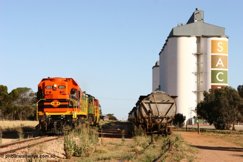 060111 2412
Wudinna, ARG 1200 class unit 1203, a Clyde Engineering EMD model G12C serial 65-427, one of fourteen originally built between 1960-65 for WAGR as their A class A 1513, fitted with dynamic brakes and financed by Western Mining Corporation, started working on the Eyre Peninsula in November 2004, 1203 and two ALCo units 850 and 905 shunt back down the mainline at Wudinna as they run round their consist. 11th January 2006.
Keywords: 1200-class;1203;Clyde-Engineering-Granville-NSW;EMD;G12C;65-427;A-class;A1513;