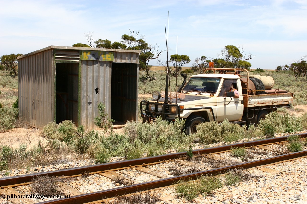060113 2557
Charra at the 466.2 km, [url=https://goo.gl/maps/GpLTsHYeUymGtK5f7]Mallee style shelter building[/url]. Opened with the line on 13th February 1966 as a goods siding, reclassified as passing siding and extended, new goods loop siding constructed May 1982. 13th January 2006.
