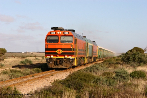 060113 2417
Ceduna, loaded gypsum train 6DD2 stirs up the dust behind the triple Clyde Engineering EMD JL22C model 1600 / NJ class combination of 1604 serial 71-731 and originally NJ 4, NJ 3 serial 71-730 and 1601 serial 71-728 class leader NJ 1, all three units started on the Central Australia Railway in 1971 and were transferred to the Eyre Peninsula in 1981. 08:10 AM on the Friday the 13th January 2006.
Keywords: 1600-class;1604;Clyde-Engineering-Granville-NSW;EMD;JL22C;71-731;NJ-class;NJ4;