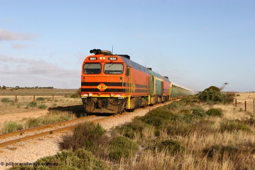 060113 2419
Ceduna, loaded gypsum train 6DD2 stirs up the dust behind the triple Clyde Engineering EMD JL22C model 1600 / NJ class combination of 1604 serial 71-731 and originally NJ 4, NJ 3 serial 71-730 and 1601 serial 71-728 class leader NJ 1, all three units started on the Central Australia Railway in 1971 and were transferred to the Eyre Peninsula in 1981. 08:10 AM on the Friday the 13th January 2006.
Keywords: 1600-class;1604;Clyde-Engineering-Granville-NSW;EMD;JL22C;71-731;NJ-class;NJ4;