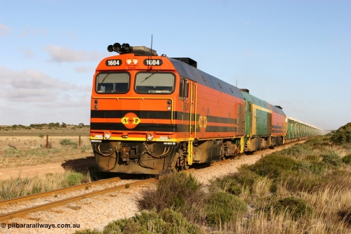 060113 2421
Ceduna, loaded gypsum train 6DD2 stirs up the dust behind the triple Clyde Engineering EMD JL22C model 1600 / NJ class combination of 1604 serial 71-731 and originally NJ 4, NJ 3 serial 71-730 and 1601 serial 71-728 class leader NJ 1, all three units started on the Central Australia Railway in 1971 and were transferred to the Eyre Peninsula in 1981. 08:10 AM on the Friday the 13th January 2006.
Keywords: 1600-class;1604;Clyde-Engineering-Granville-NSW;EMD;JL22C;71-731;NJ-class;NJ4;