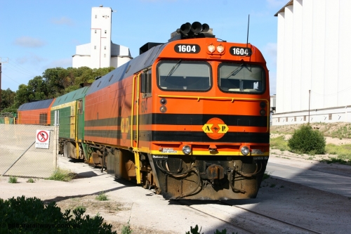 060113 2443
Thevenard, at the Gypsum Resources Australian (GRA) gypsum unloading site, 1604 leads a triple consist of Clyde Engineering EMD JL22C model 1600 / NJ class combination of 1604 serial 71-731 and originally NJ 4, NJ 3 serial 71-730 and 1601 serial 71-728 class leader NJ 1, all three units started on the Central Australia Railway in 1971 and were transferred to the Eyre Peninsula in 1981. 1604 and 1601 both renumbered in 2004. Friday 13th January 2006.
Keywords: 1600-class;1604;Clyde-Engineering-Granville-NSW;EMD;JL22C;71-731;NJ-class;NJ4;