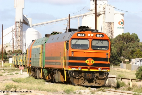 060113 2469
Thevenard, narrow gauge loco 1604 departs the yard with empty train 6DD3, 1604 leads a triple consist of Clyde Engineering built EMD JL22C model 1600 / NJ class combination of 1604 serial 71-731 and originally NJ 4, NJ 3 serial 71-730 and 1601 serial 71-728 the original class leader NJ 1, all three units started on the Central Australia Railway in 1971 and were transferred to the Eyre Peninsula in 1981. 1604 and 1601 both renumbered in 2004. 13th January 2006.
Keywords: 1600-class;1604;Clyde-Engineering-Granville-NSW;EMD;JL22C;71-731;NJ-class;NJ4;