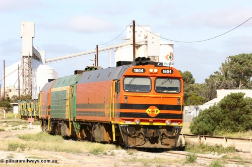 060113 2470
Thevenard, narrow gauge loco 1604 departs the yard with empty train 6DD3, 1604 leads a triple consist of Clyde Engineering built EMD JL22C model 1600 / NJ class combination of 1604 serial 71-731 and originally NJ 4, NJ 3 serial 71-730 and 1601 serial 71-728 the original class leader NJ 1, all three units started on the Central Australia Railway in 1971 and were transferred to the Eyre Peninsula in 1981. 1604 and 1601 both renumbered in 2004. 13th January 2006.
Keywords: 1600-class;1604;Clyde-Engineering-Granville-NSW;EMD;JL22C;71-731;NJ-class;NJ4;