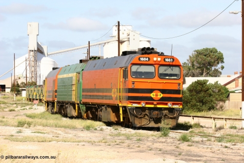 060113 2471
Thevenard, narrow gauge loco 1604 departs the yard with empty train 6DD3, 1604 leads a triple consist of Clyde Engineering built EMD JL22C model 1600 / NJ class combination of 1604 serial 71-731 and originally NJ 4, NJ 3 serial 71-730 and 1601 serial 71-728 the original class leader NJ 1, all three units started on the Central Australia Railway in 1971 and were transferred to the Eyre Peninsula in 1981. 1604 and 1601 both renumbered in 2004. 13th January 2006.
Keywords: 1600-class;1604;Clyde-Engineering-Granville-NSW;EMD;JL22C;71-731;NJ-class;NJ4;