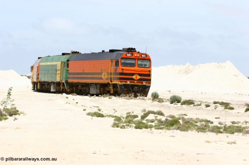 060113 2511
Kevin, empty train 6DD3 shunts back onto the triangle leg behind triple NJ/1600 class units, Clyde Engineering built EMD JL22C models, originally coded the NJ class and built for the Central Australia Railway in 1971, transferred to the Eyre Peninsula in 1981 and recoded to the 1600 class. January 13, 2006.
Keywords: 1600-class;1604;Clyde-Engineering-Granville-NSW;EMD;JL22C;71-731;NJ-class;NJ4;