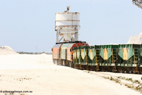 060113 2531
Kevin, empty train 6DD3 is heading onto the south leg with some of the gypsum plant behind the train and a set of original loading bins gypsum loading siding to continue the reversing process. January 13, 2006.
