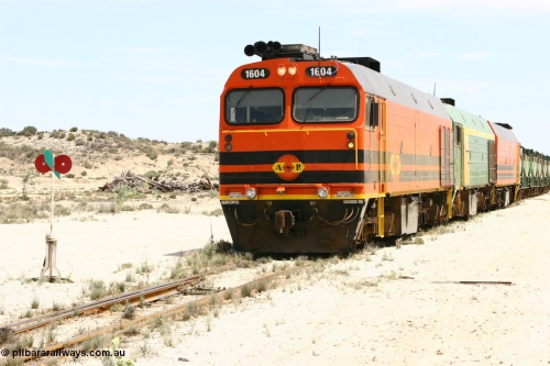 060113 2541
Kevin, narrow gauge locos 1604, NJ 3 and 1601 sit on the mainline to Penong, having reversed train 6DD3 on the Kevin triangle 1600 class unit 1604 in Australian Railroad Group livery a Clyde Engineering built EMD JL22C model serial 71-731, originally built as NJ class NJ 4 and built for the Central Australia Railway in 1971, transferred to the Eyre Peninsula in 1981. 13th January 2006.
Keywords: 1600-class;1604;Clyde-Engineering-Granville-NSW;EMD;JL22C;71-731;NJ-class;NJ4;