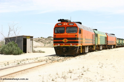 060113 2544
Kevin, narrow gauge locos 1604, NJ 3 and 1601 take the mainline to Thevenard, having reversed train 6DD3 on the Kevin triangle as they prepare to load, 1600 class unit 1604 in Australian Railroad Group livery a Clyde Engineering built EMD JL22C model serial 71-731, originally built as NJ class NJ 4 and built for the Central Australia Railway in 1971, transferred to the Eyre Peninsula in 1981. 13th January 2006.
Keywords: 1600-class;1604;Clyde-Engineering-Granville-NSW;EMD;JL22C;71-731;NJ-class;NJ4;