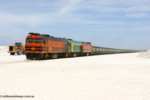 060113 2549
Kevin, standing on the mainline to Thevenard, and the train now identified as 6DD4 has commenced loading of gypsum but the 988 Cat front end loaders which takes about one and half hours to load. As the train reversed on the triangle the consist is the same heading back loaded with 1604 leading NJ 3 and 1601. 13th January 2006.
Keywords: 1600-class;1604;Clyde-Engineering-Granville-NSW;EMD;JL22C;71-731;NJ-class;NJ4;