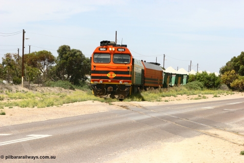 060113 2561
Thevenard, loaded gypsum train 6DD4 snakes through the yard as it is about to cross Bergmann Drive behind 1600 class unit 1604 in Australian Railroad Group livery a Clyde Engineering built EMD JL22C model serial 71-731, originally built as NJ class NJ 4. [url=https://goo.gl/maps/9g3QoE4iaiDjqyta9]Bergmann Dr grade crossing[/url]. 13th January 2006.
Keywords: 1600-class;1604;Clyde-Engineering-Granville-NSW;EMD;JL22C;71-731;NJ-class;NJ4;