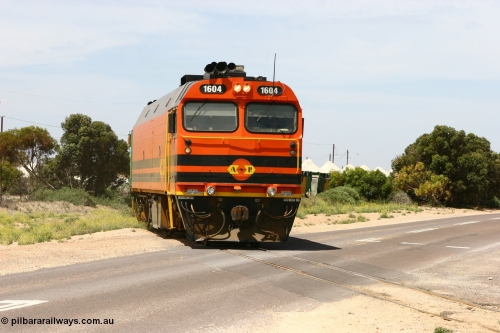060113 2563
Thevenard, loaded gypsum train 6DD4 snakes through the yard and crosses Bergmann Drive behind 1600 class unit 1604 in Australian Railroad Group livery a Clyde Engineering built EMD JL22C model serial 71-731, originally built as NJ class NJ 4. [url=https://goo.gl/maps/9g3QoE4iaiDjqyta9]Bergmann Dr grade crossing[/url]. 13th January 2006.
Keywords: 1600-class;1604;Clyde-Engineering-Granville-NSW;EMD;JL22C;71-731;NJ-class;NJ4;