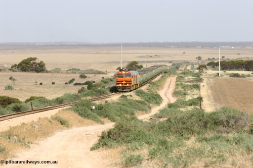060113 2572
Ceduna, or Denial Bay area, empty gypsum train 6DD5 blasts up hill at the 440 km, crossing Carpenter Corner Rd with power from triple 1600/NJ class units 1604, NJ 3 and 1601. 1604 in Australian Railroad Group livery is a Clyde Engineering built EMD JL22C model serial 71-731, originally built as NJ class NJ 4. [url=https://goo.gl/maps/ULA2PjjKh6nhwHTdA]Location approximation[/url]. 13th January 2006.
Keywords: 1600-class;1604;Clyde-Engineering-Granville-NSW;EMD;JL22C;71-731;NJ-class;NJ4;