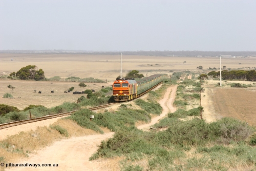 060113 2573
Ceduna, or Denial Bay area, empty gypsum train 6DD5 blasts up hill at the 440 km, crossing Carpenter Corner Rd with power from triple 1600/NJ class units 1604, NJ 3 and 1601. 1604 in Australian Railroad Group livery is a Clyde Engineering built EMD JL22C model serial 71-731, originally built as NJ class NJ 4. [url=https://goo.gl/maps/ULA2PjjKh6nhwHTdA]Location approximation[/url]. 13th January 2006.
Keywords: 1600-class;1604;Clyde-Engineering-Granville-NSW;EMD;JL22C;71-731;NJ-class;NJ4;