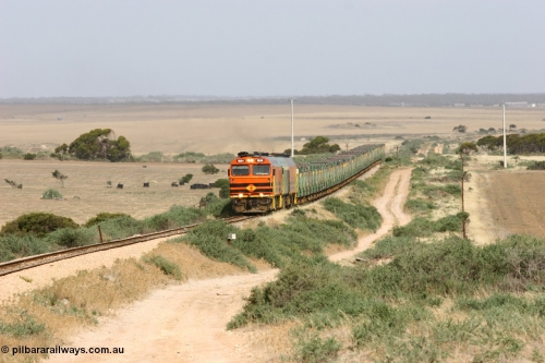 060113 2575
Ceduna, or Denial Bay area, empty gypsum train 6DD5 blasts up hill at the 440 km, crossing Carpenter Corner Rd with power from triple 1600/NJ class units 1604, NJ 3 and 1601. 1604 in Australian Railroad Group livery is a Clyde Engineering built EMD JL22C model serial 71-731, originally built as NJ class NJ 4. [url=https://goo.gl/maps/ULA2PjjKh6nhwHTdA]Location approximation[/url]. 13th January 2006.
Keywords: 1600-class;1604;Clyde-Engineering-Granville-NSW;EMD;JL22C;71-731;NJ-class;NJ4;