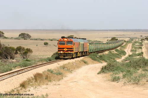 060113 2577
Ceduna, or Denial Bay area, empty gypsum train 6DD5 blasts up hill at the 440 km, west of Carpenter Corner Rd with power from triple 1600/NJ class units 1604, NJ 3 and 1601. 1604 in Australian Railroad Group livery is a Clyde Engineering built EMD JL22C model serial 71-731, originally built as NJ class NJ 4. [url=https://goo.gl/maps/ULA2PjjKh6nhwHTdA]Location approximation[/url]. 13th January 2006.
Keywords: 1600-class;1604;Clyde-Engineering-Granville-NSW;EMD;JL22C;71-731;NJ-class;NJ4;