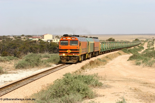 060113 2581
Ceduna, or Denial Bay area, empty gypsum train 6DD5 blasts up hill at the 440 km, west of Carpenter Corner Rd with power from triple 1600/NJ class units 1604, NJ 3 and 1601. 1604 in Australian Railroad Group livery is a Clyde Engineering built EMD JL22C model serial 71-731, originally built as NJ class NJ 4. [url=https://goo.gl/maps/ULA2PjjKh6nhwHTdA]Location approximation[/url]. 13th January 2006.
Keywords: 1600-class;1604;Clyde-Engineering-Granville-NSW;EMD;JL22C;71-731;NJ-class;NJ4;