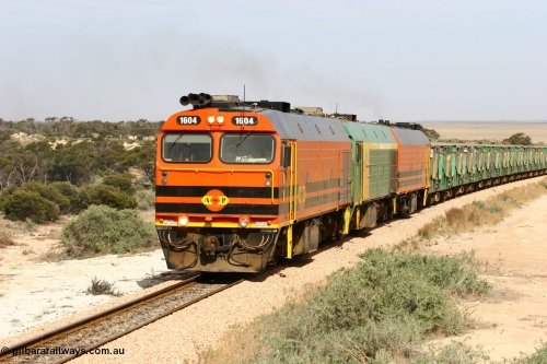 060113 2584
Ceduna, or Denial Bay area, empty gypsum train 6DD5 blasts up hill at the 440 km, west of Carpenter Corner Rd with power from triple 1600/NJ class units 1604, NJ 3 and 1601. 1604 in Australian Railroad Group livery is a Clyde Engineering built EMD JL22C model serial 71-731, originally built as NJ class NJ 4. [url=https://goo.gl/maps/ULA2PjjKh6nhwHTdA]Location approximation[/url]. 13th January 2006.
Keywords: 1600-class;1604;Clyde-Engineering-Granville-NSW;EMD;JL22C;71-731;NJ-class;NJ4;