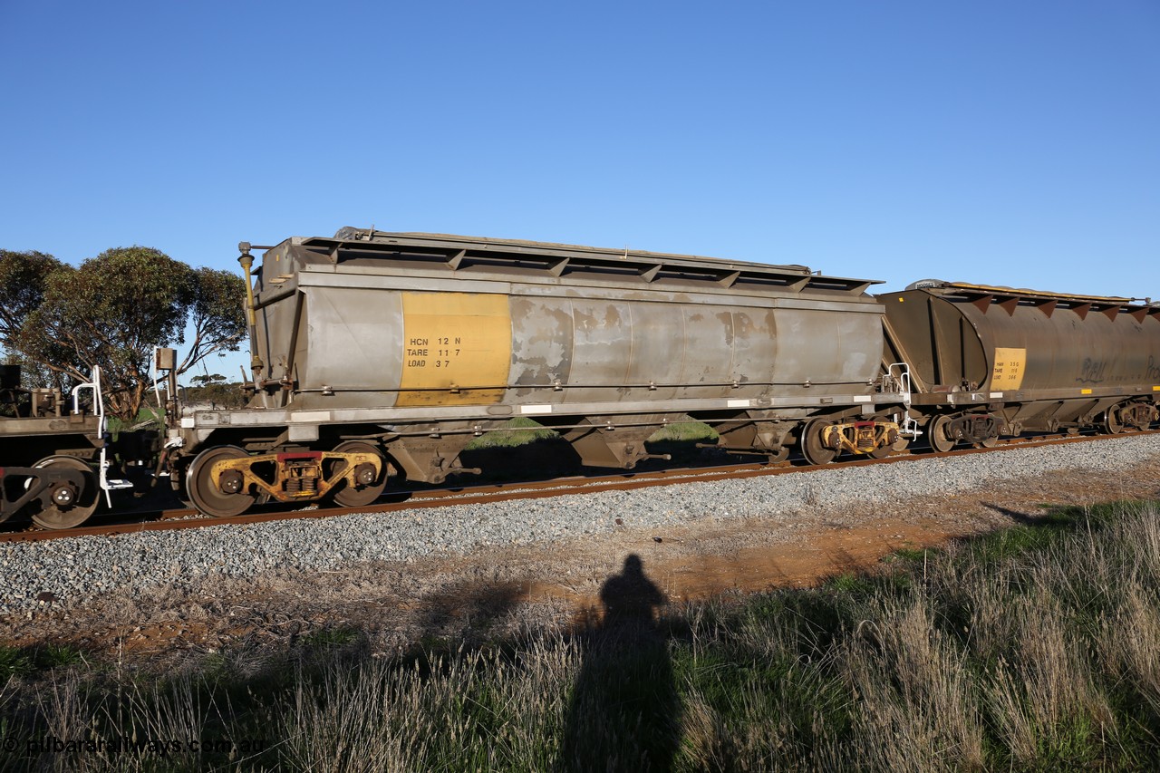 130703 0273
Kaldow, HCN type bogie grain hopper waggon HCN 12, originally an NHB type hopper built by Tulloch Ltd for the Commonwealth Railways North Australia Railway. One of forty rebuilt by Islington Workshops 1978-79 to the HCN type with a 36 ton rating, increased to 40 tonnes in 1984. Seen here loaded with grain with a Moose Metalworks roll-top cover. [url=https://goo.gl/maps/bG8SzxeWzL1eSEWUA]Geo location[/url]. 3rd July 2013.
Keywords: HCN-type;HCN12;SAR-Islington-WS;rebuild;Tulloch-Ltd-NSW;NHB-type;NHB1591;