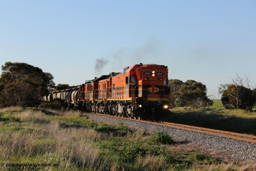 130703 0251
Kaldow, running south with the sun behind it is 1200 class 1204 a Clyde Engineering built EMD G12C model with serial 65-428 leading two ALCo units and was originally built in 1965 for Western Mining Corporation and operated by the WAGR as their A class A 1513. It came to the Eyre Peninsula in October 2004. [url=https://goo.gl/maps/FnDpXh45LbN7scrt5]Geo location[/url]. 3rd July 2013.
Keywords: 1200-class;1203;Clyde-Engineering-Granville-NSW;EMD;G12C;65-427;A-class;A1513;