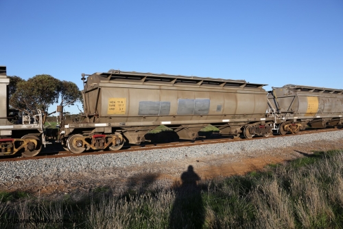 130703 0274
Kaldow, HCN type bogie grain hopper waggon HCN 11, originally an NHB type hopper built by Tulloch Ltd for the Commonwealth Railways North Australia Railway. One of forty rebuilt by Islington Workshops 1978-79 to the HCN type with a 36 ton rating, increased to 40 tonnes in 1984. Seen here loaded with grain with a Moose Metalworks roll-top cover. [url=https://goo.gl/maps/bG8SzxeWzL1eSEWUA]Geo location[/url]. 3rd July 2013.
Keywords: HCN-type;HCN11;SAR-Islington-WS;rebuild;Tulloch-Ltd-NSW;NHB-type;NHB1007;