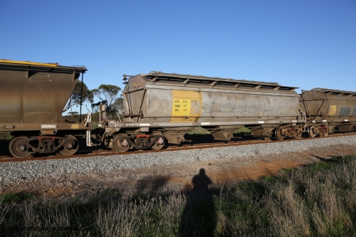 130703 0275
Kaldow, HCN type bogie grain hopper waggon HCN 4, originally an NHB type hopper built by Tulloch Ltd for the Commonwealth Railways North Australia Railway. One of forty rebuilt by Islington Workshops 1978-79 to the HCN type with a 36 ton rating, increased to 40 tonnes in 1984. Seen here loaded with grain with a Moose Metalworks roll-top cover.
Keywords: HCN-type;HCN4;SAR-Islington-WS;rebuild;Tulloch-Ltd-NSW;NHB-type;NHB1017;