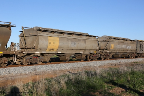 130703 0281
Kaldow, HCN type bogie grain hopper waggon HCN 33, originally an NHB type hopper built by Tulloch Ltd for the Commonwealth Railways North Australia Railway. One of forty rebuilt by Islington Workshops 1978-79 to the HCN type with a 36 ton rating, increased to 40 tonnes in 1984. Seen here loaded with grain with a Moose Metalworks roll-top cover.
Keywords: HCN-type;HCN33;SAR-Islington-WS;rebuild;Tulloch-Ltd-NSW;NHB-type;NHB1011;