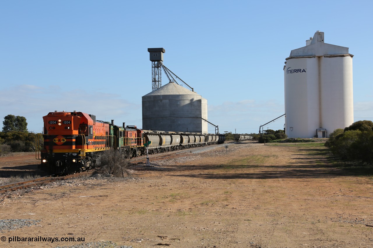 130704 0372
Kyancutta, south bound loaded grain train has stopped here to collect a loaded rack of fourteen grain waggons from the Ascom silo complex, Clyde Engineering built EMD G12C model 1204 serial 65-428 leads the train and was originally built in 1965 for Western Mining Corporation and operated by the WAGR as their A class A 1514.
Keywords: 1200-class;1204;Clyde-Engineering-Granville-NSW;EMD;G12C;65-428;A-class;A1514;