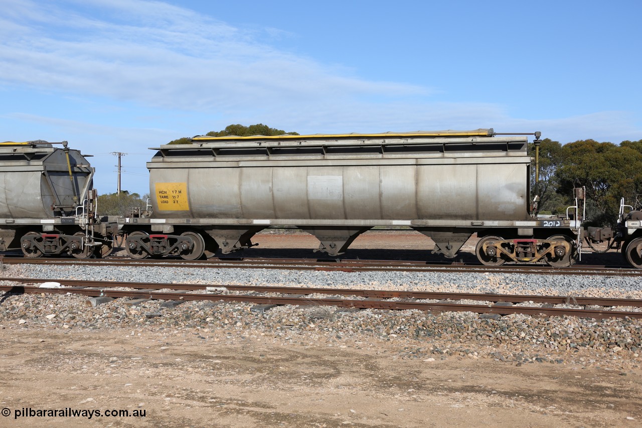 130704 0400
Kyancutta, HCN type bogie grain hopper waggon HCN 17, originally an NHB type hopper built by Tulloch Ltd for the Commonwealth Railways North Australia Railway. One of forty rebuilt by Islington Workshops 1978-79 to the HCN type with a 36 ton rating, increased to 40 tonnes in 1984. Seen here loaded with grain with a Moose Metalworks roll-top cover.
Keywords: HCN-type;HCN17;SAR-Islington-WS;rebuild;Tulloch-Ltd-NSW;NHB-type;NHB1016;
