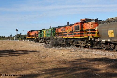 130704 0416
Kyancutta, south bound loaded grain train has stopped here to collect a loaded rack of grain waggons, seen here backing up to re-join the rest of the train on the mainline with one of only three electric signals on the network which a sharp eye might notice has turned green, behind EMD 1204 and twin ALCo 830 units 873 and 851. July 4, 2006.
Keywords: 830-class;851;AE-Goodwin;ALCo;DL531;84137;