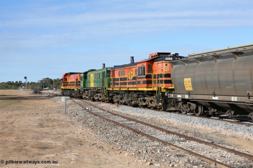 130704 0422
Kyancutta, south bound loaded grain train has stopped here to collect a loaded rack of grain waggons, seen here backing up to re-join the rest of the train on the mainline with one of only three electric signals on the network with the original goods siding closest to the camera, behind EMD 1204 and twin ALCo 830 units 873 and 851. July 4, 2006.
Keywords: 830-class;851;AE-Goodwin;ALCo;DL531;84137;