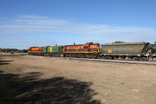 130704 0425
Kyancutta, south bound loaded grain train has stopped here to collect a loaded rack of grain waggons, seen here testing the brake after rejoining the train, with the original goods siding closest to the camera, behind EMD 1204 and twin ALCo 830 units 873 and 851. 4th July 2013.
Keywords: HAN-type;HAN54;1969-73/68-54;SAR-Islington-WS;