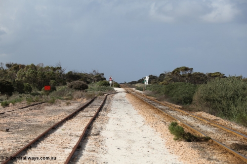130704 0487
Moule, looking east, Moule located at the 445.6 km was opened in February 1966 when the Direct Line between Ceduna and Kevin was opened. From the left is the end of the ballast siding with the crossing loop rejoining the mainline just before the grade crossing to access the ballast stockpile area. [url=https://goo.gl/maps/KTtpy7LJB4tmHaTt6]Location is here[/url]. 4th July 2013.
