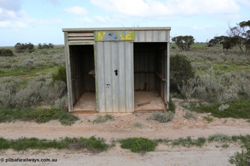 130704 0491
Moule, Mallee style shelter shed as a station 'building' of sorts. Moule was opened in February 1966 when the Direct Line between Ceduna and Kevin was opened. It hosts a crossing loop and ballast loading siding, [url=https://goo.gl/maps/KTtpy7LJB4tmHaTt6]Location is here[/url]. 4th July 2013.
