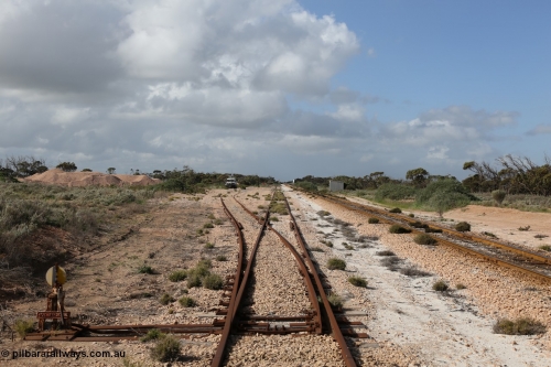 130704 0493
Moule, yard view looking east from the points for the single ended ballast siding with ballast pile of the left. Moule located at the 445.6 km was opened in February 1966 when the Direct Line between Ceduna and Kevin was opened. It hosts a crossing loop and ballast loading siding, [url=https://goo.gl/maps/14Xf9VRbSC6hkoQz5]Location is here[/url]. 4th July 2013.
