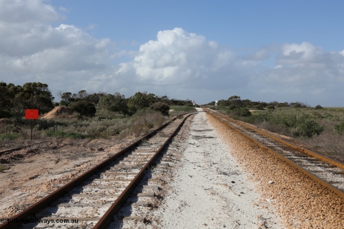130704 0499
Moule, looking east, Moule located at the 445.6 km was opened in February 1966 when the Direct Line between Ceduna and Kevin was opened. From the left is the end of the ballast siding with the crossing loop rejoining the mainline just before the grade crossing to access the ballast stockpile area. [url=https://goo.gl/maps/6J6z67u4tB7HJBcDA]Location is here[/url]. 4th July 2013.
