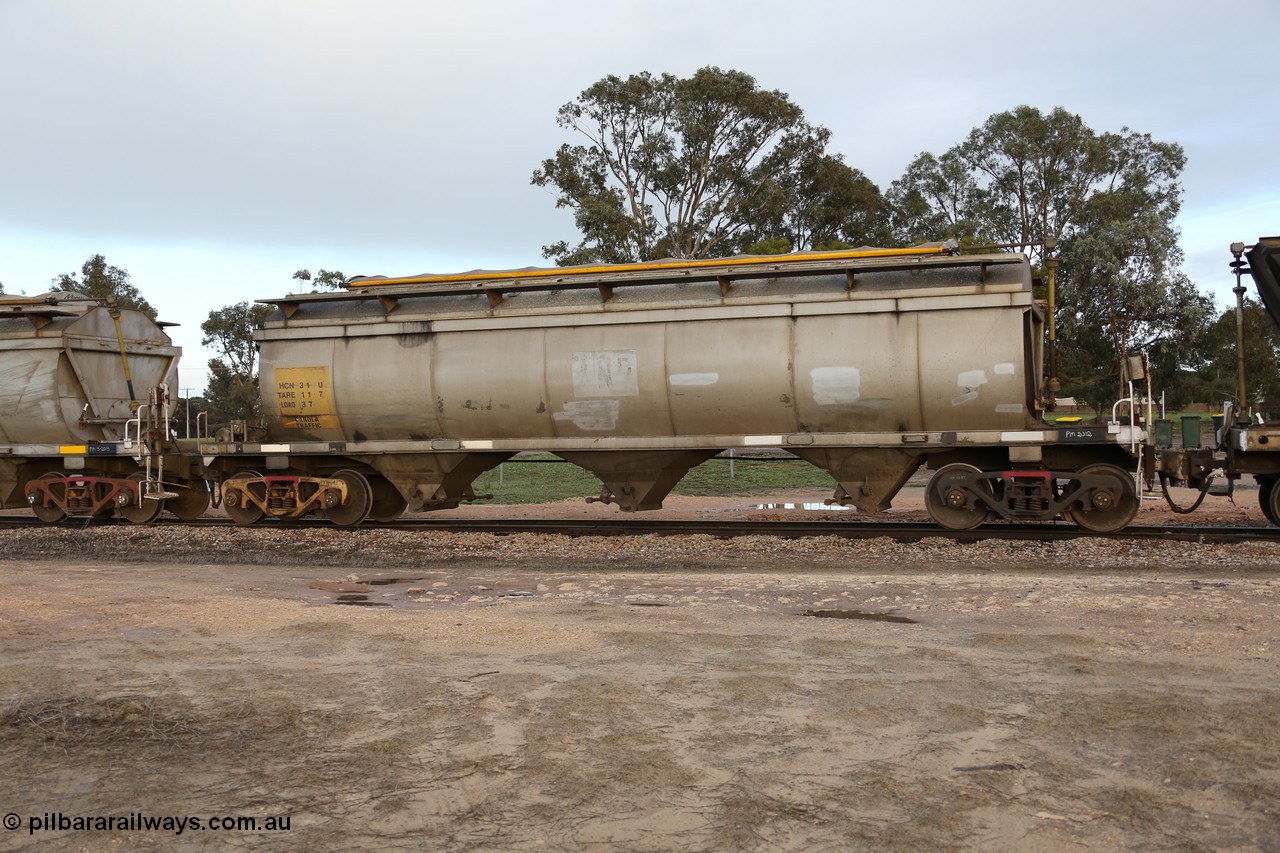 130705 0560
Lock, HCN type bogie grain hopper waggon HCN 31, originally an NHB type hopper NHB 1579 built by Tulloch Ltd for the Commonwealth Railways North Australia Railway. One of forty rebuilt by Islington Workshops 1978-79 to the HCN type with a 36 ton rating, increased to 40 tonnes in 1984. Fitted with a Moose Metalworks roll-top cover. 5th July 2013.
Keywords: HCN-type;HCN31;SAR-Islington-WS;rebuild;Tulloch-Ltd-NSW;NHB-type;NHB1579;