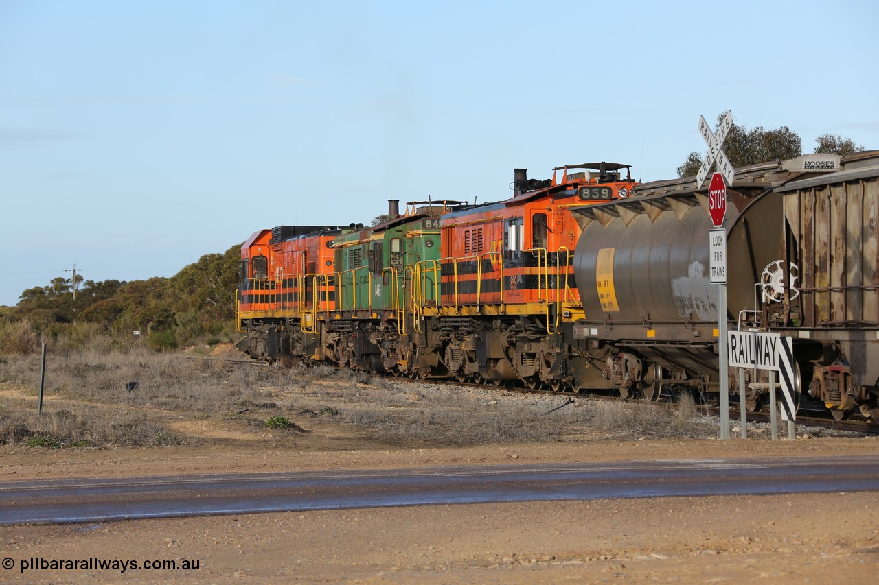130705 0627
Lock, with loading finished, 1203 leads 846, 859 and the final portion out along the mainline out of goods siding #1 across Birdseye Hwy as it prepares to shunt back onto the loaded portion on the mainline for departure to Port Lincoln.
