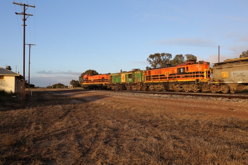 130705 0526
Lock, 1203, 846 and 859 shunt their loading grain train out of the siding onto the mainline. Genesee & Wyoming locomotive AE Goodwin ALCo model DL531 unit 859 'City of Port Lincoln' serial 84705, built in 1963, 859 started life at Peterborough, spent some years in Tasmania and even spent time in Perth on standard gauge in 2002 before being repainted and transferred to the Eyre Peninsula system in 2003. The barracks are just visible at left. 5th of July 2013.
Keywords: 830-class;859;AE-Goodwin;ALCo;DL531;84705;